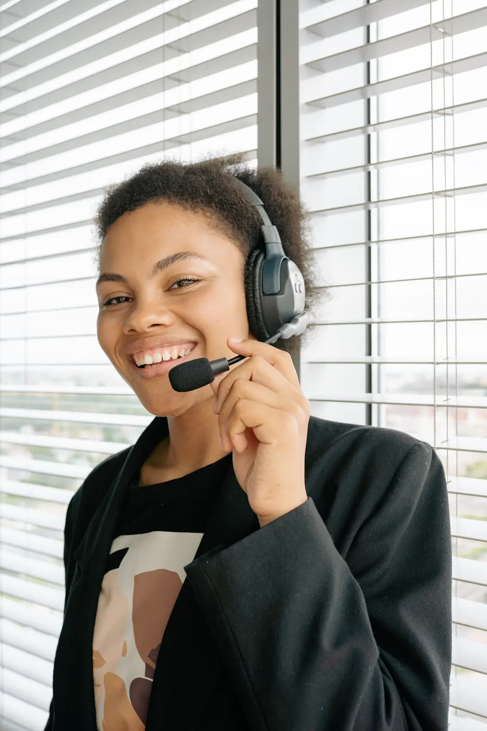 A member of the Right Rides support team wearing a headset, smiling