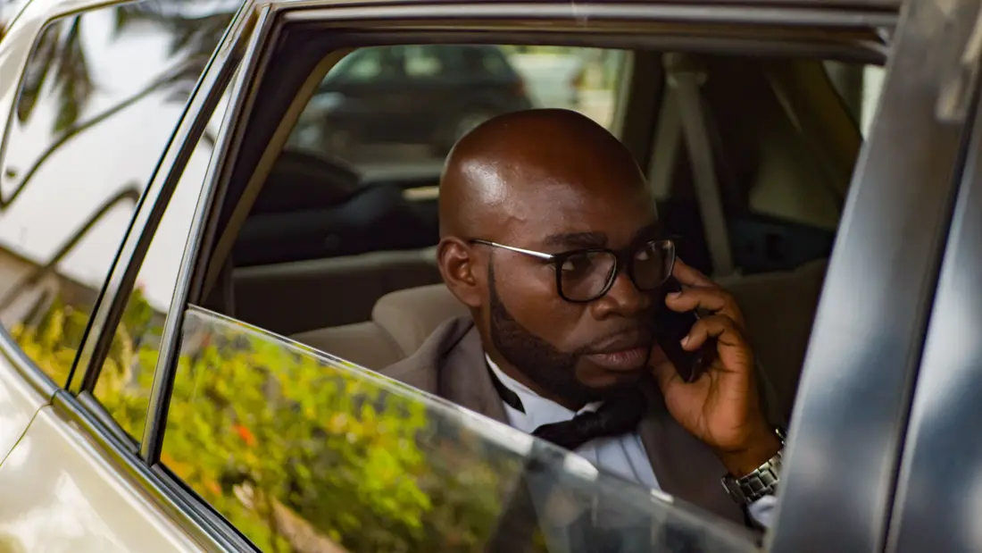 Taking a call from the back seat